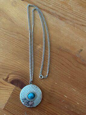 Vintage-style locked necklace featured a round, etched metal pendant w/stone